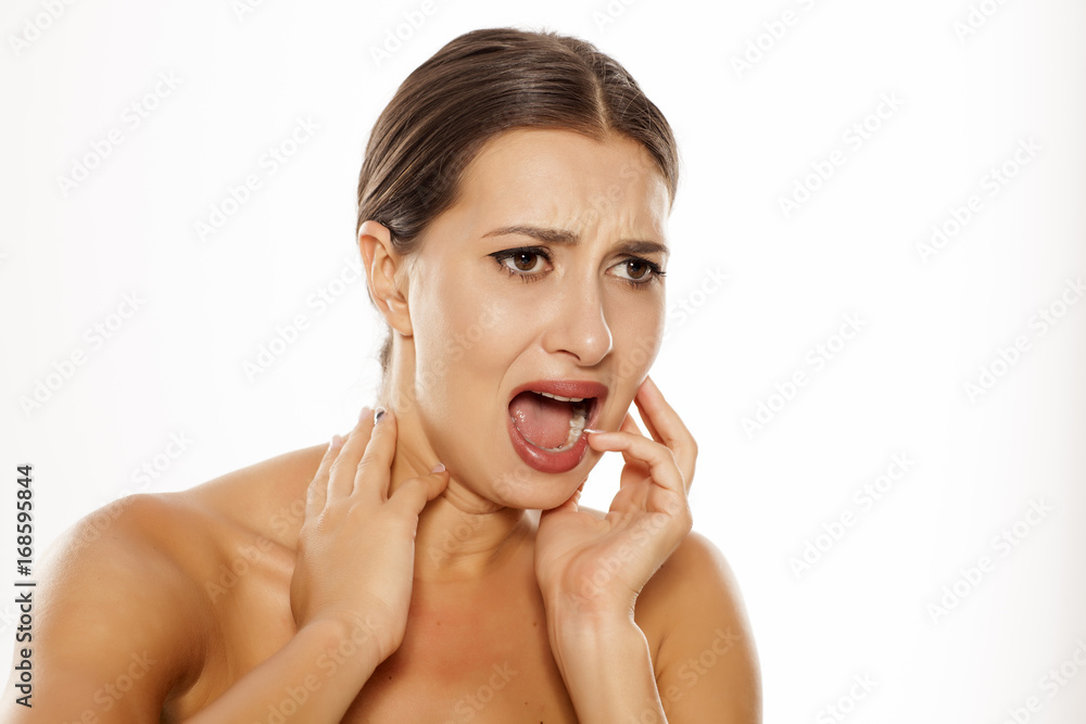 Portrait of afraid young woman on white background Portrait of afraid young woman on white background