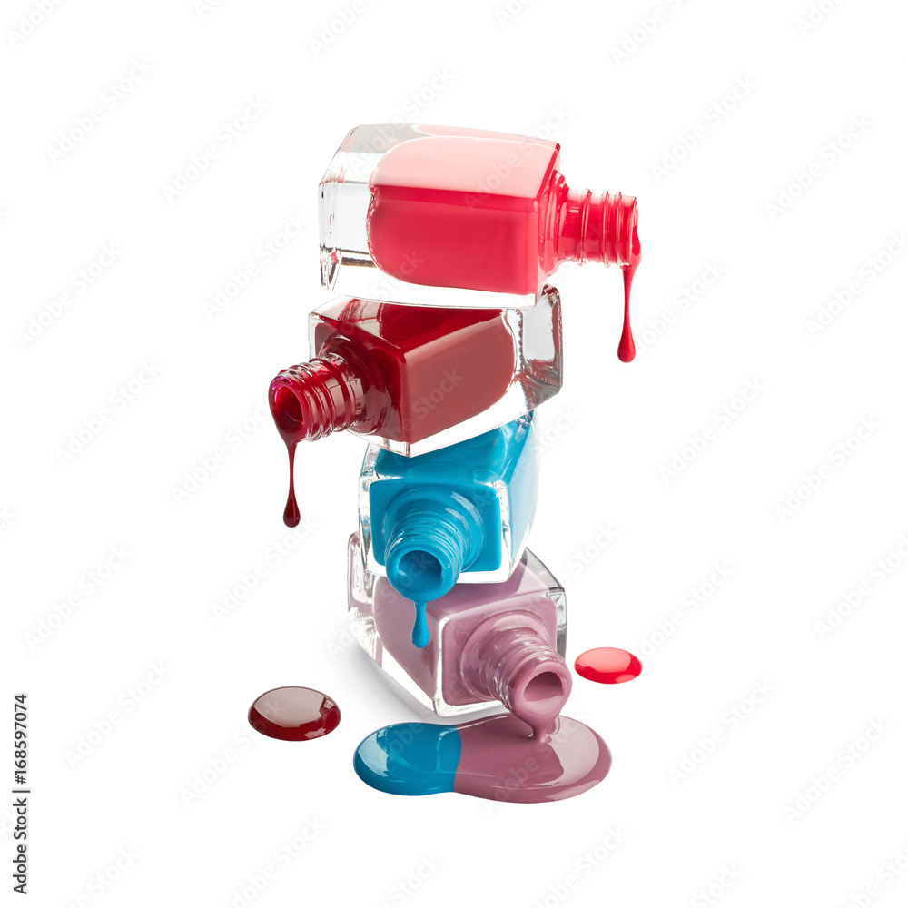 Bottles with spilled nail polish isolated on white background Bottles with spilled nail polish isolated on white background
