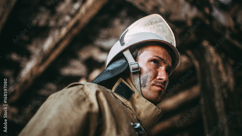 Russian fireman exploring buildin after fire face closeup