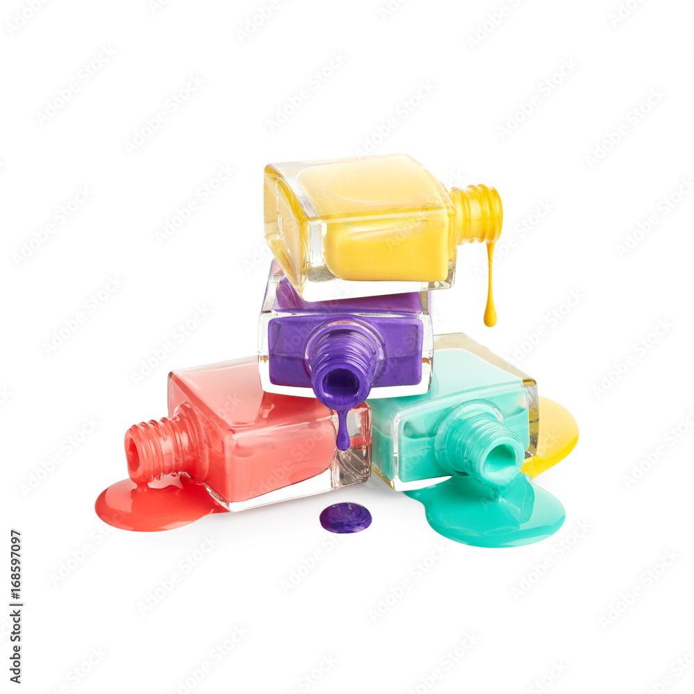 Stack of bottles with spilled nail polish isolated on white background Stack of bottles with spilled nail polish isolated on white background