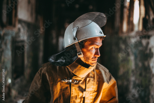 Russian fireman exploring buildin after fire face closeup