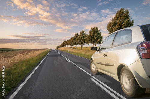 A view of a car passing by the road