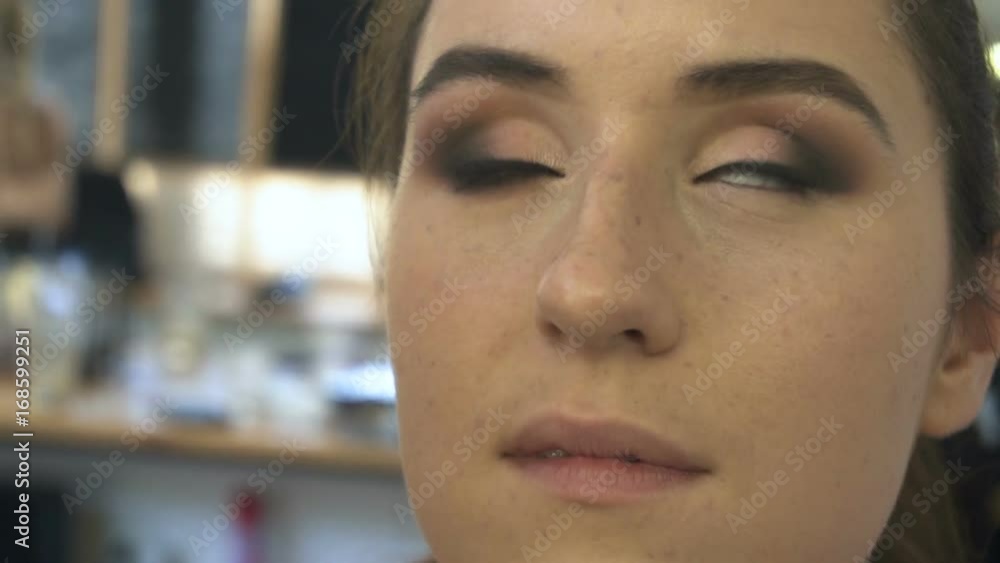 Professional make-up artist making face makeup art. Make up and fashion concept Professional make-up artist making face makeup art. Make up and fashion concept