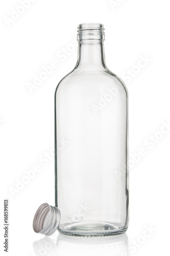 Empty glass bottle close up on white background