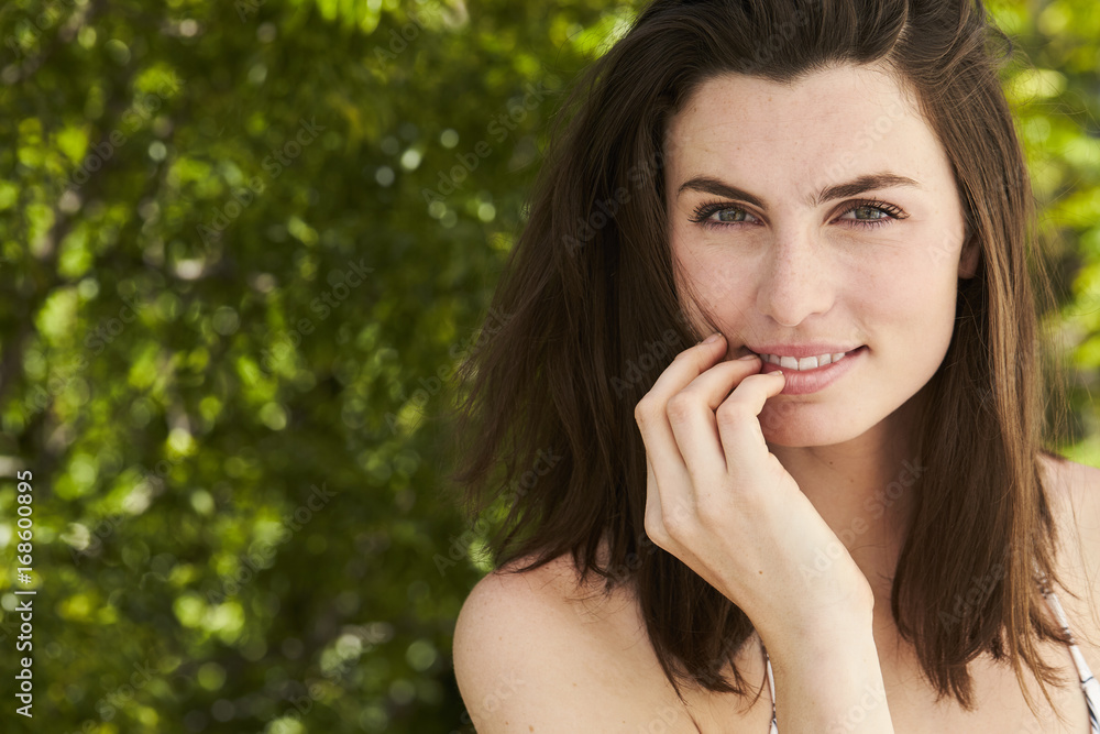 Beautiful brunette woman smiling to camera, portrait Beautiful brunette woman smiling to camera, portrait