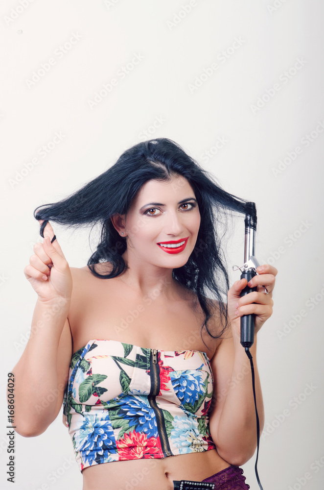 Fototapeta premium girl with the rectifier of hair
