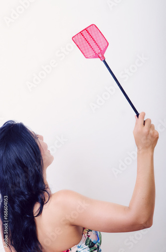 girl with a fly swatter photo