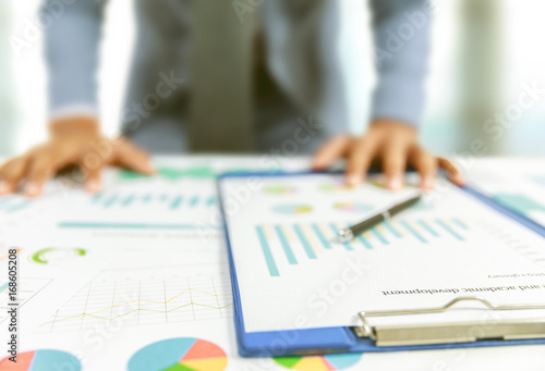 businessman write business plan with chart
