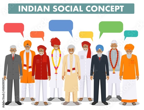 Social concept. Group indian senior people and speech bubbles standing together in different traditional national clothes on white background in flat style. Vector illustration.