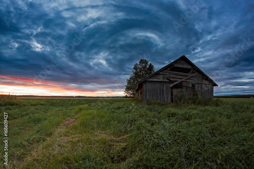 Circle Of Clouds Over The Old Barn House