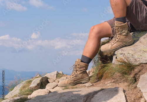 The guy in trekking boots. close-up