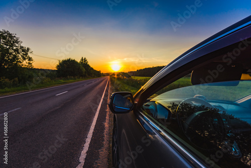 Car on the side of the road sunset © dbrus