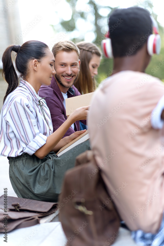 multiethnic students reading books multiethnic students reading books