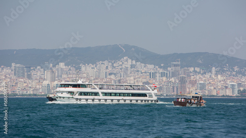 Passenger ferryboat in the middle of Bosphorus Strait Turkey. Against the background of the city of Istanbul. © Dmytro