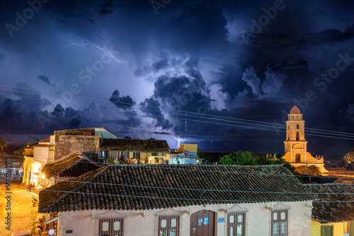 Beautiful night image of Trinidad Cuba under a stom photo