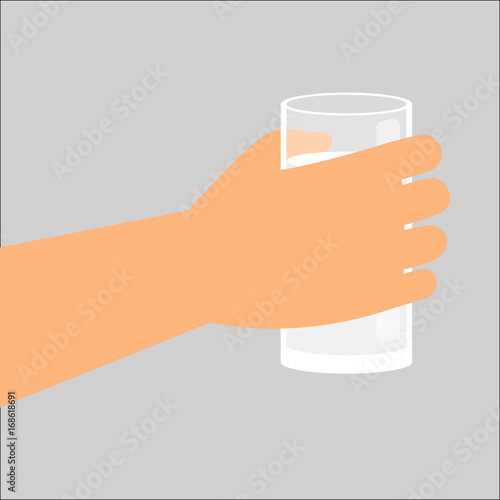 Hand holding glass with fresh milk