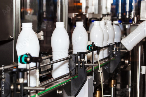 Milk industry with ackaging bottles line processing © prescott09