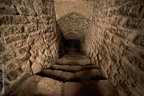 Stepped descent into the dungeon of the medieval castle