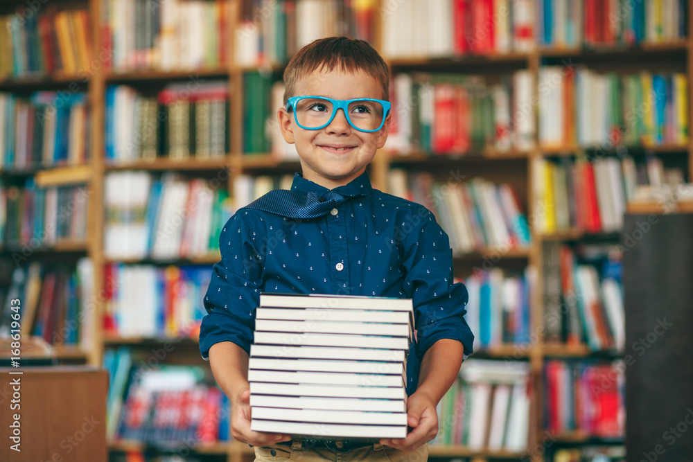 Boy with stack of books Boy with stack of books