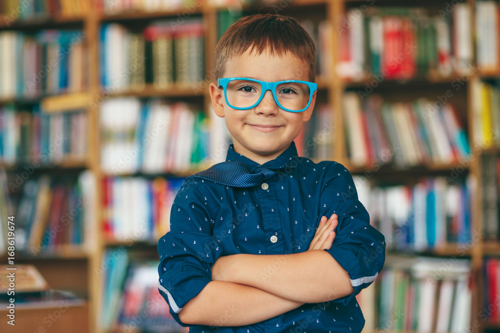 Boy with glasses in library Boy with glasses in library