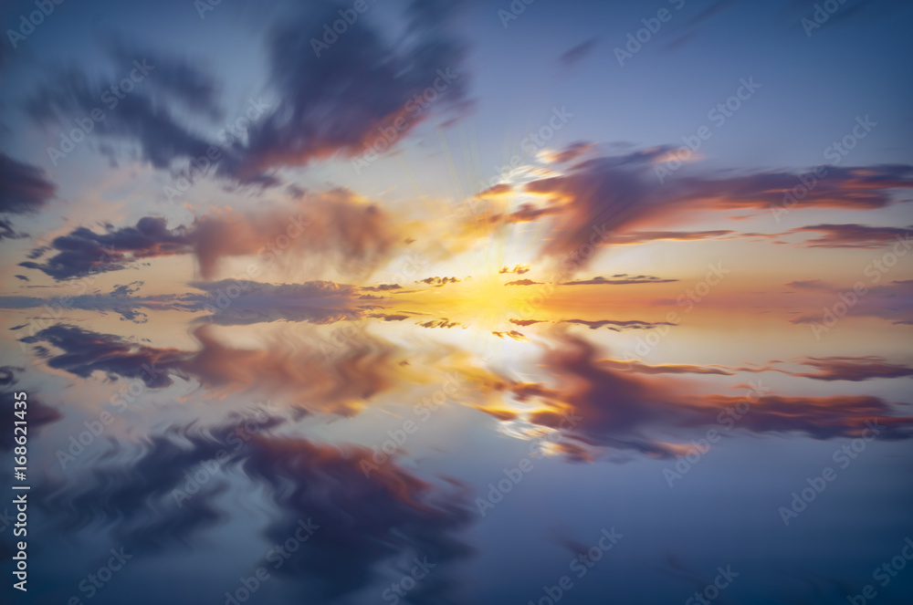 Fototapeta premium sky, dramatic sunset with colorful clouds and the reflection of the sky in the water