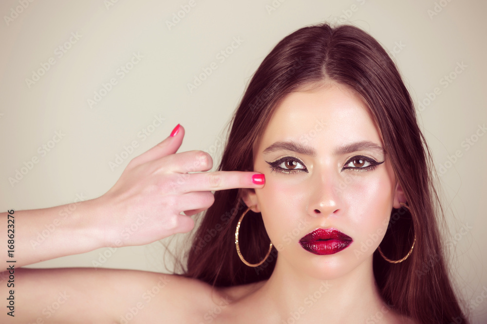 Woman has stylish long hair in earrings. Woman has stylish long hair in earrings.