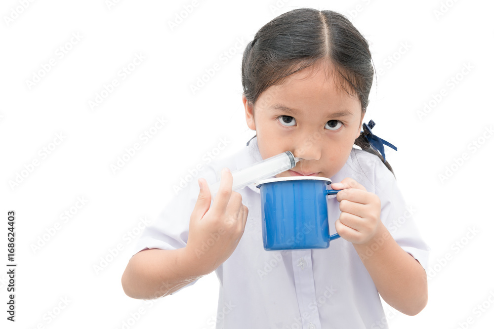 asian student girl flushing her nose with syringe and saline isolated asian student girl flushing her nose with syringe and saline isolated