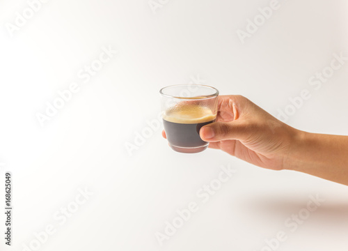 hand holding a glass of expresso coffee with white blackground copy space, clipping paths