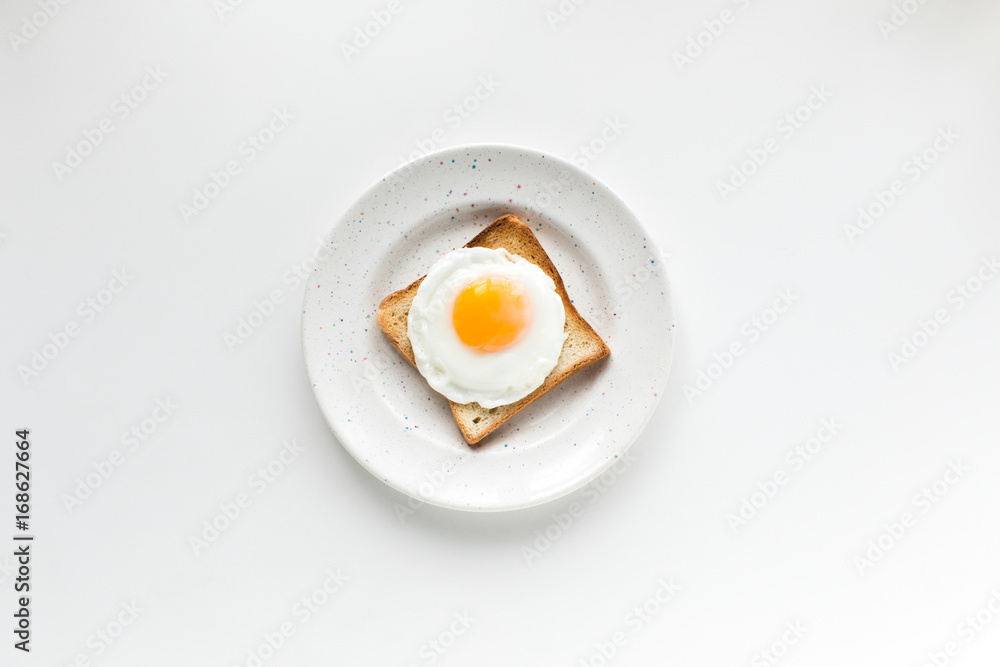 top view of breakfast with fried egg on toast, isolated on white top view of breakfast with fried egg on toast, isolated on white