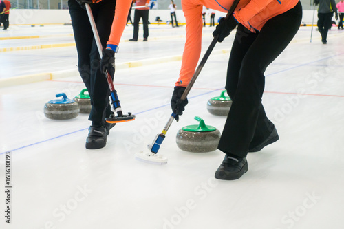 Team members play in curling at championship