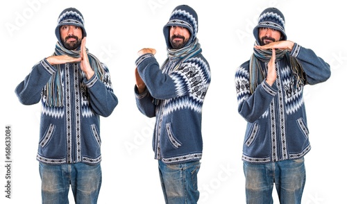 Set of Man with winter clothes making time out gesture
