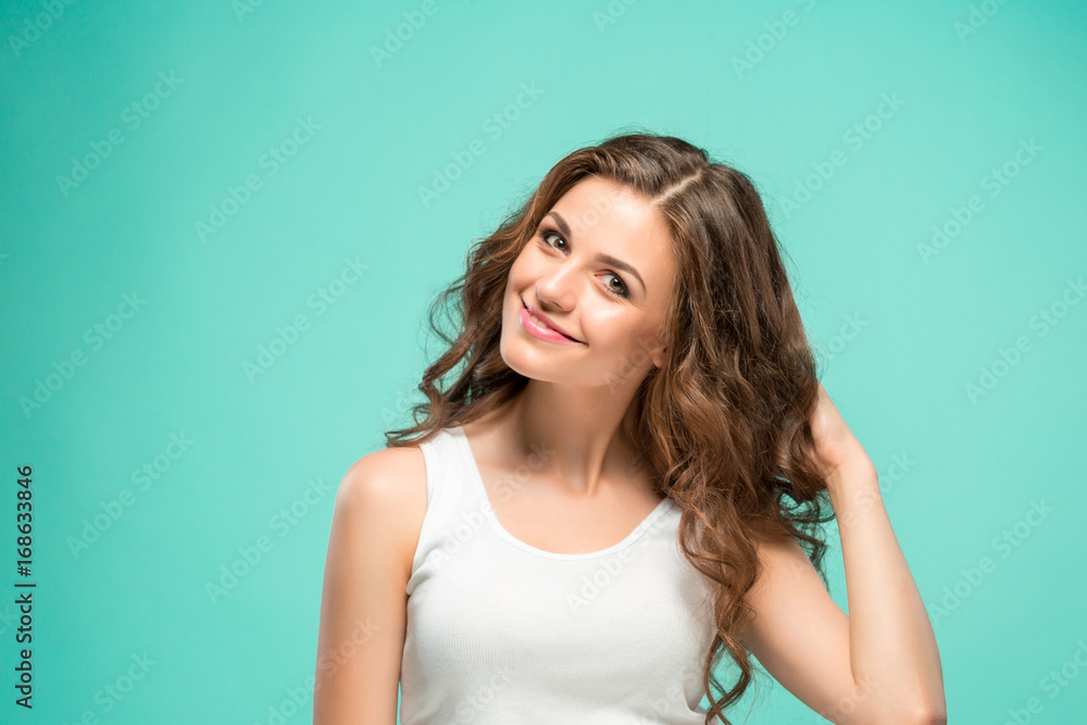 The young woman's portrait with happy emotions The young woman's portrait with happy emotions