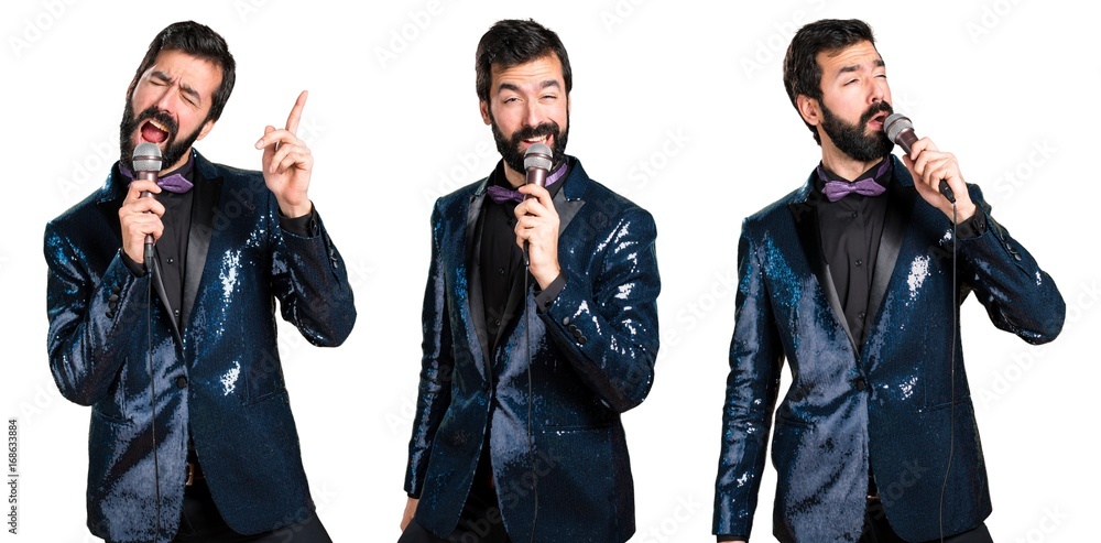 Handsome man with sequin jacket singing with microphone