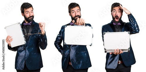 Handsome man with sequin jacket holding a briefcase
