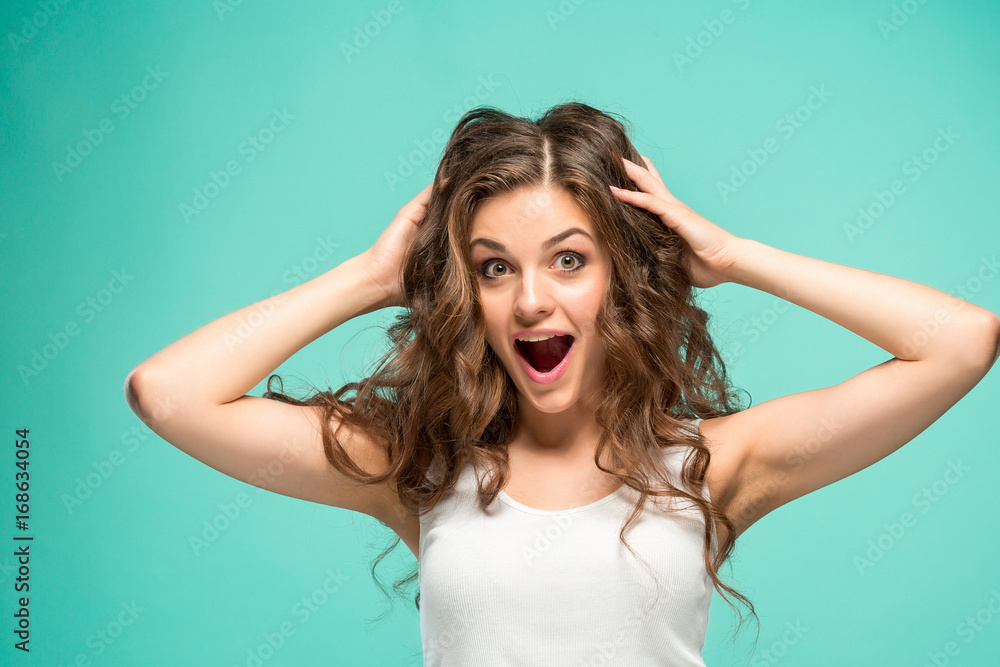 The young woman's portrait with happy emotions The young woman's portrait with happy emotions