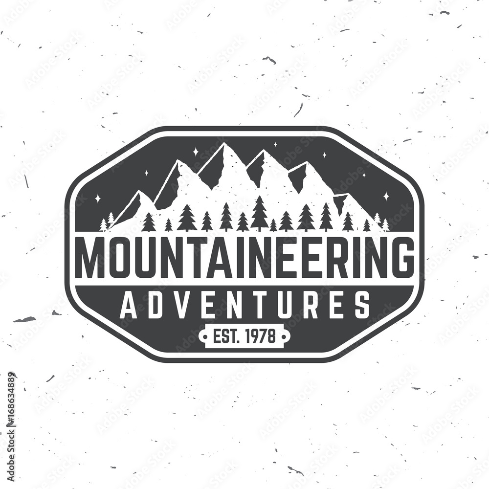 Vintage typography design with mountain silhouette.