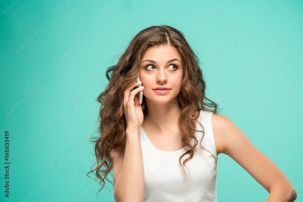 The portrait of disgusted woman with mobile phone The portrait of disgusted woman with mobile phone
