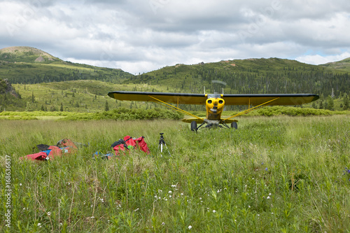 Two people film the takeoff of a airplane photo