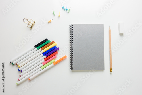 Minimal work space - Creative flat lay photo of workspace desk with sketchbook and wooden pencil on copy space white background. Top view , flat lay photography.