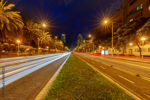 Barcelona. Avenue to the port Olympique at night. © pillerss