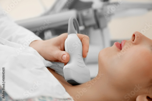 Doctor conducting ultrasoun...