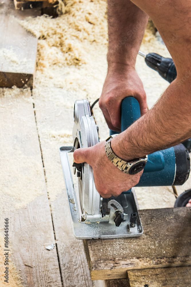Carpenter Using His Circular Saw Carpenter Using His Circular Saw