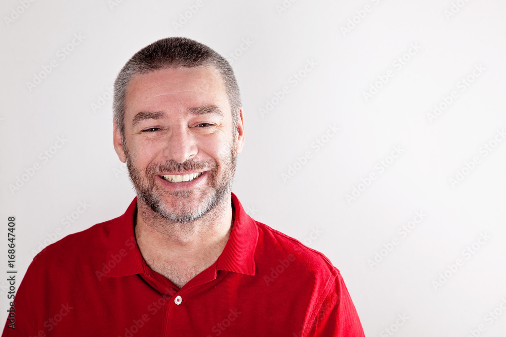 Stylish mature man laughing to the camera Stylish mature man laughing to the camera