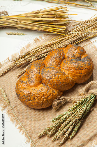 Wicker bread and wheat on a white background