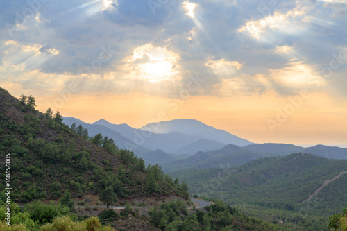 Mediterranean mountains during sunset over the forest