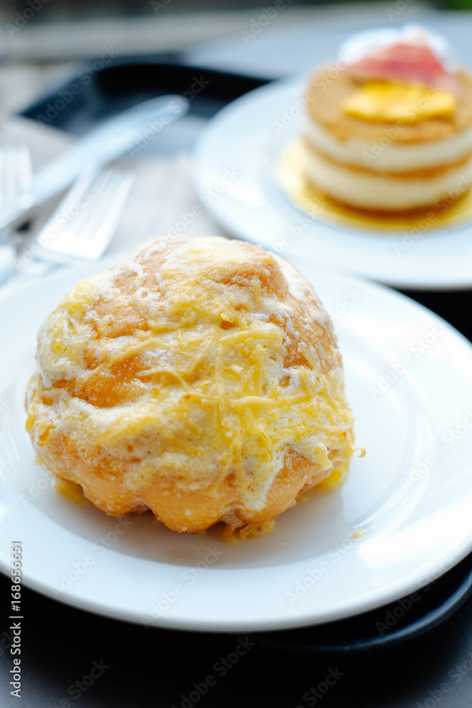 Pinoy Ensaymada bread, with sugar and cheese on top Pinoy Ensaymada bread, with sugar and cheese on top