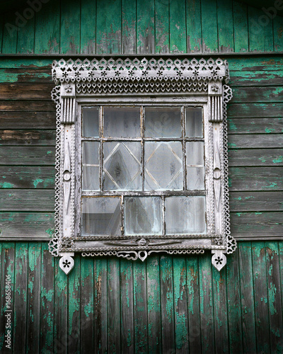 An old window with carved platbands