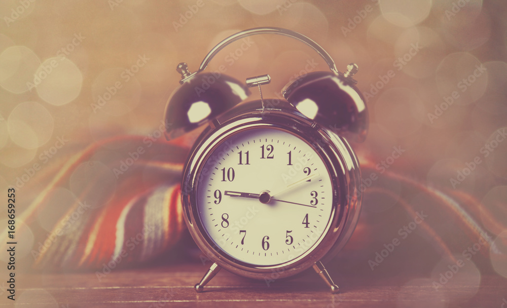 Alarm clock and scarf. Alarm clock and scarf.