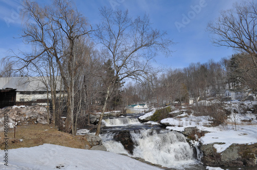 Winter waterfall with blue sky background in the Poconos Pennsylvania