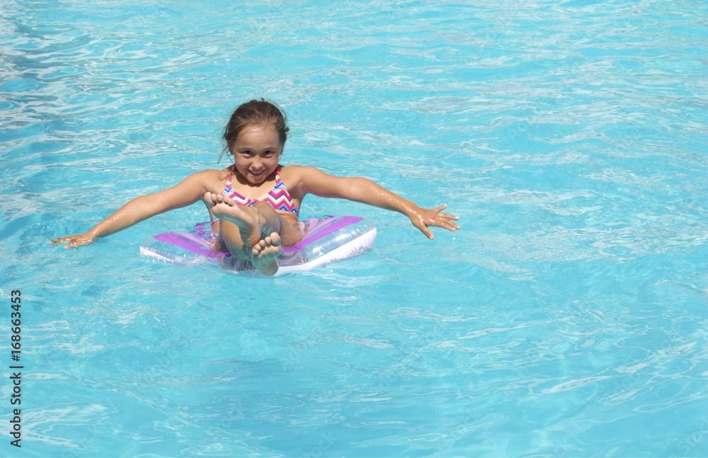 Little girl having fun in the pool